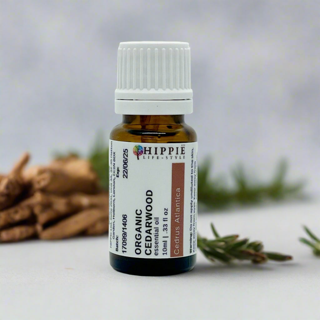 Organic Cedarwood Atlas Essential Oil with leaves and twigs