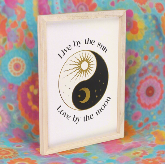 Celestial Yin and Yang print framed wall art featuring a harmonious design with the phrase 'Live by the sun, love by the moon.' This inspirational home decor piece promotes balance in life and positive energy, perfect for creating tranquility in any space.