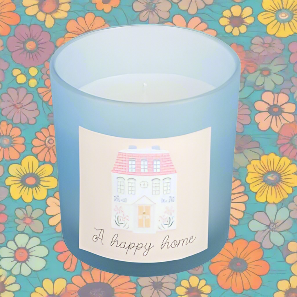 Charming candle with fresh linen fragrance and a sweet pastel house design, ideal for celebrating home joy and presented in a matching gift box