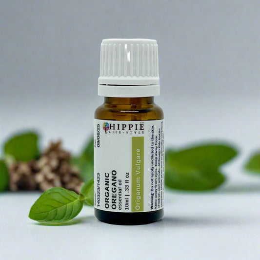 a bottle of pure organic essential oil from the UK surrounded by Oregano in a professional product photo.