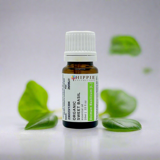 a professional product shot of a pure and therapeutic sweet basil linalool bottle surrounded by basil leaves